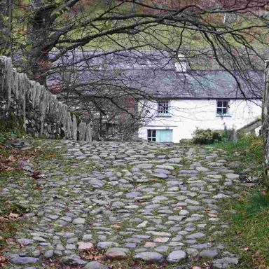 Cross the ancient packhorse bridge